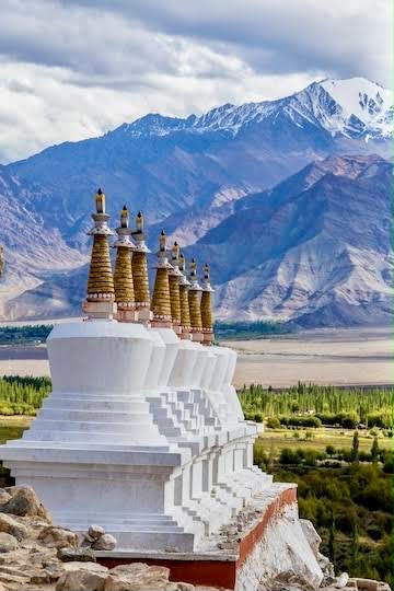 Snow-covered mountains and the village of Tosh in Himachal Pradesh, Indian Himalayas