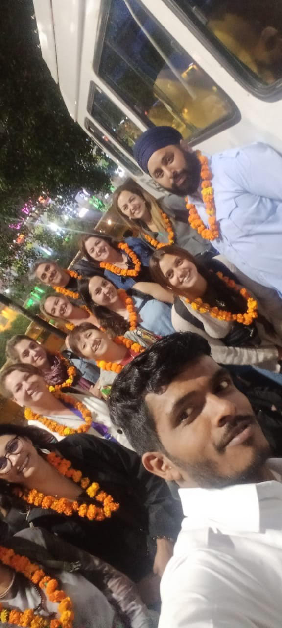 Amit with a group of travellers