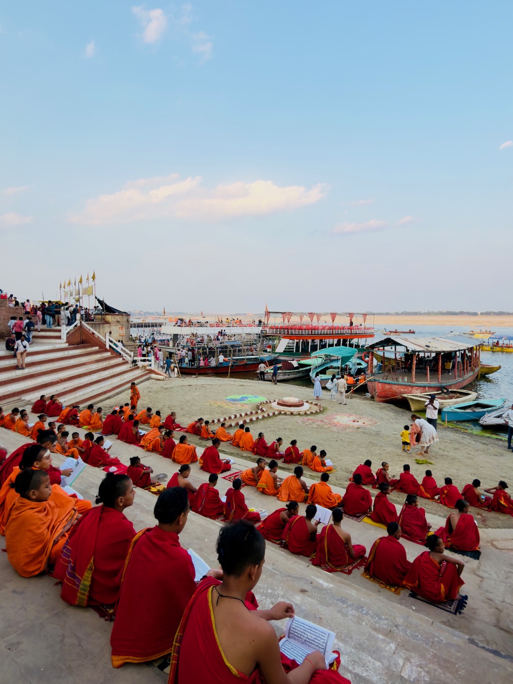 Monks seated beside the Ganges in Varanasi